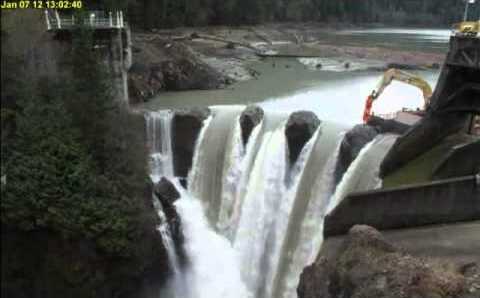 The 210-foot Glines Canyon Dam on the Elwha River being demolished in stages, notch-and-release method, May 2016